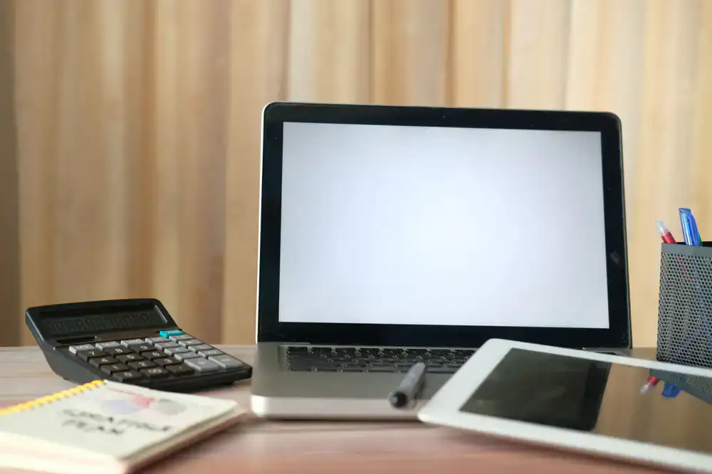 Clean, modern desk setup representing organized business accounting