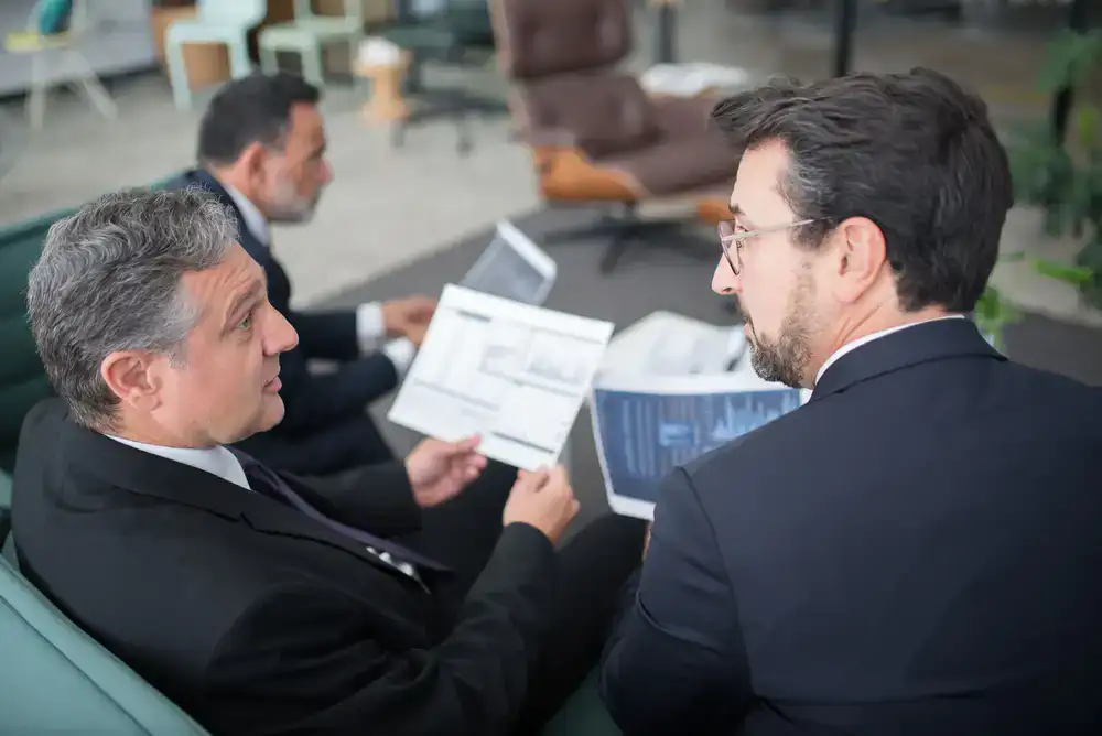 Ledger and Co representative discussing onboarding documents with a small business client